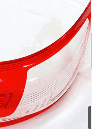 A clear automotive light cover produced via injection molding