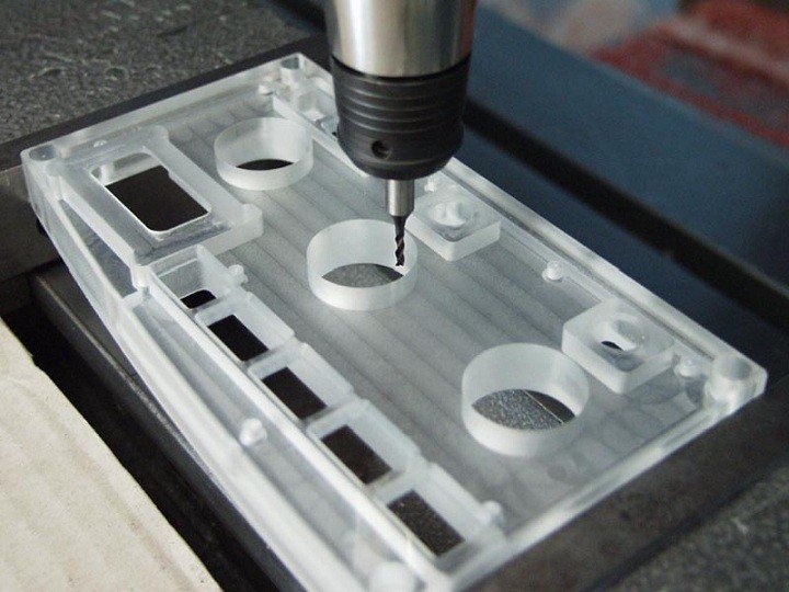 A CMM machine inspecting a part, highlighting the precision required for scientific instruments