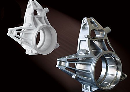 A 5-axis CNC machine producing a high-gloss part